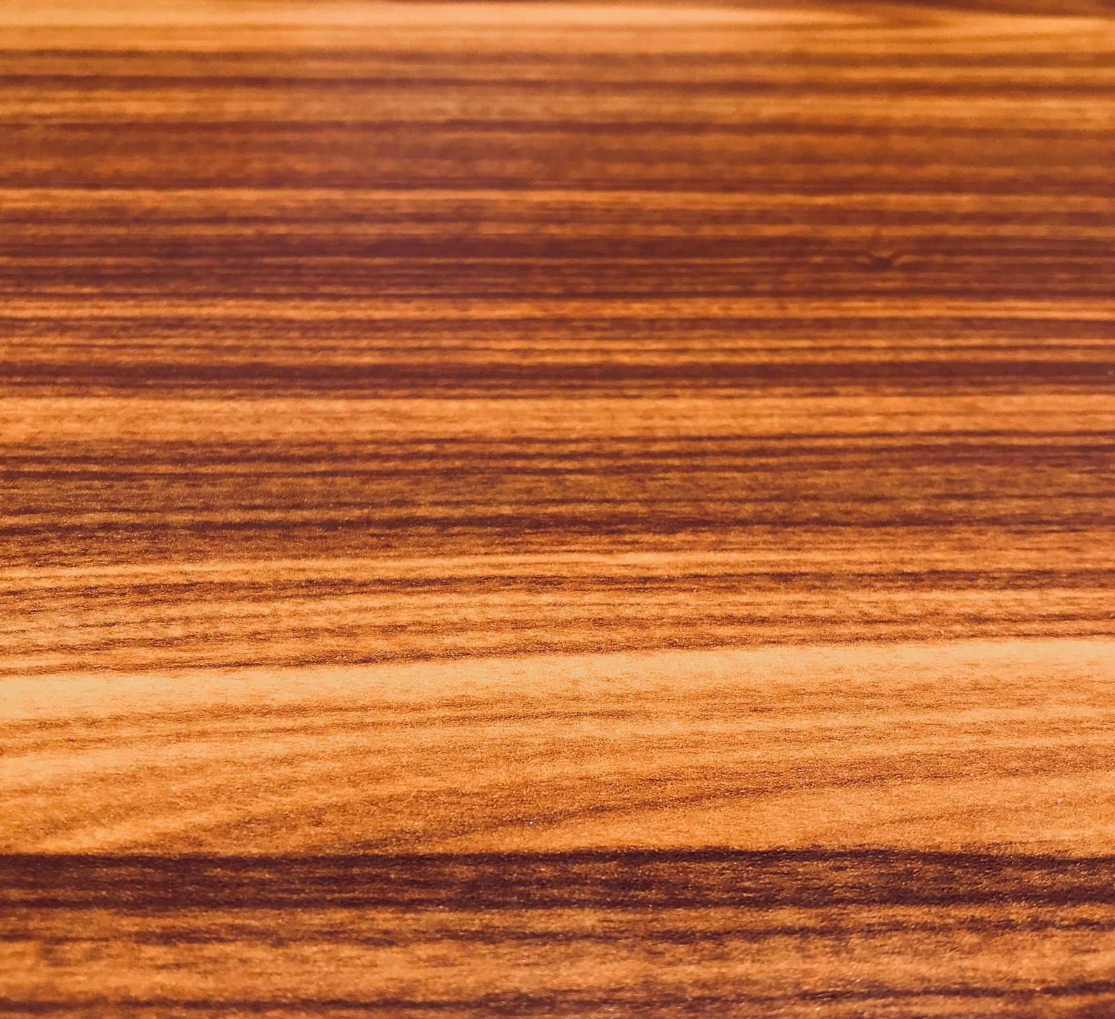 brown honey finished wood grain background perfect for a wallpaper or a text or image overlay